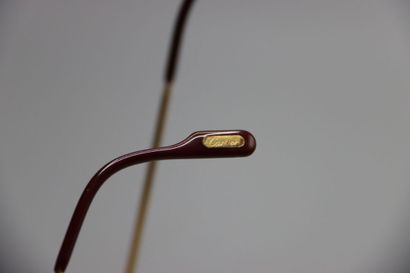 CARTIER, Paris. Paire de lunettes en métal...