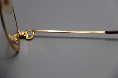 CARTIER, Paris. Paire de lunettes en métal...