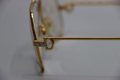 CARTIER, Paris. Paire de lunettes en métal...