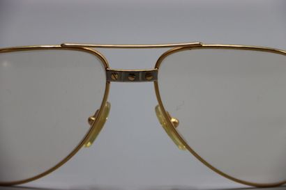 CARTIER, Paris. Paire de lunettes en métal...