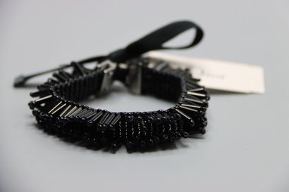 CHRISTIAN DIOR. Bracelet tubes noirs.