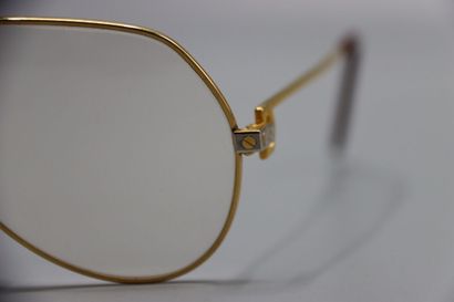 CARTIER, Paris. Paire de lunettes en métal...