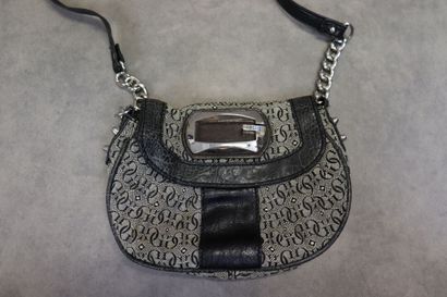 GUESS. Un petit sac à main en toile et cuir....