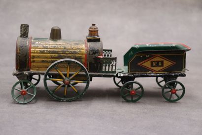 Une locomotive avec trois wagons, tôle polychrome....