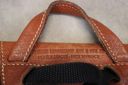 LONGCHAMPS. Réunion d'un sac, deux pochettes...