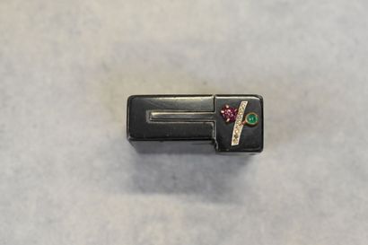CARTIER. Un briquet art déco en métal et...
