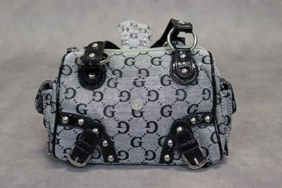 GUESS. Un petit sac à main en toile et cuir....