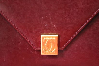 CARTIER. Petit sac bandoulière en cuir grainé...