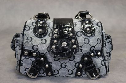 GUESS. Un petit sac à main en toile et cuir....