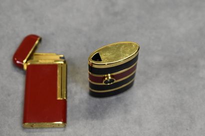 Yves Saint Laurent. Réunion de deux briquets...