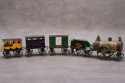 Une locomotive avec trois wagons, tôle polychrome....