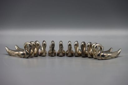 12 silver plated knife holders in the shape...