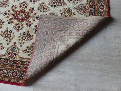 Oriental carpet with floral pattern on a...