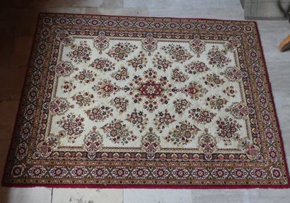Oriental carpet with floral pattern on a...