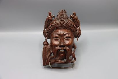 ASIA : Mask representing a crowned man with...