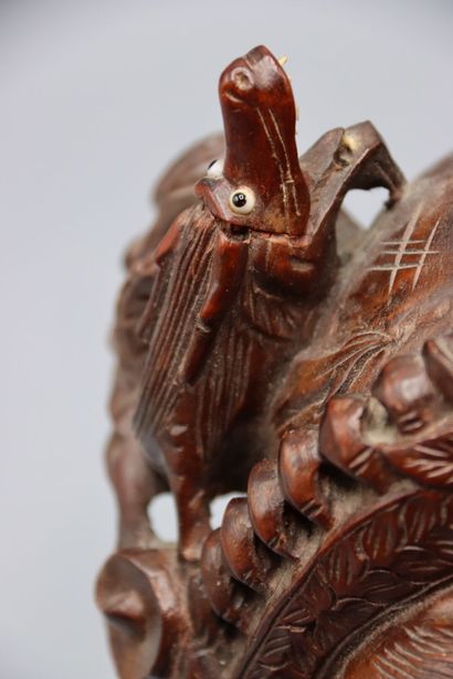 ASIA : Mask representing a crowned man with...