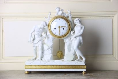 Pendule en biscuit et bronze doré à décor...