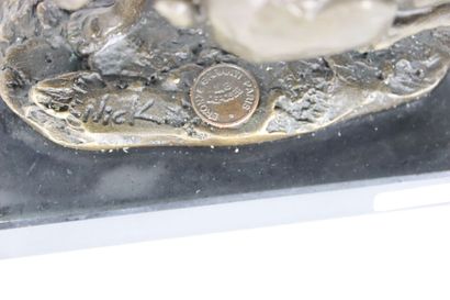 Bronze representing two hares running side...