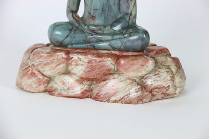 ASIA. BUDDHA in meditation on a pile of rocks,...
