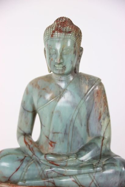 ASIA. BUDDHA in meditation on a pile of rocks,...