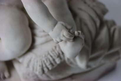 MOUGIN, Enfant assis sur un coussin à fleurs...