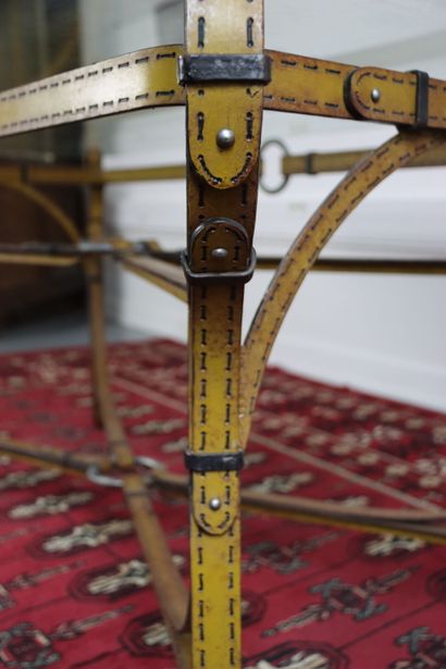 Wrought iron table decorated with yellow...