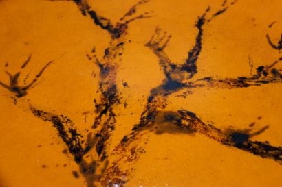 Large round terracotta dish, orange enamel...