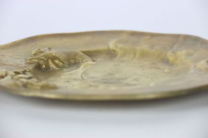 Gilt bronze dish decorated in relief with...
