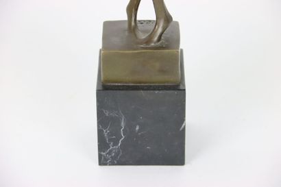 Large statue in bronze, representing a stylized...