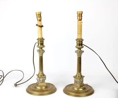 Pair of lamps in gilded brass, the shaft...