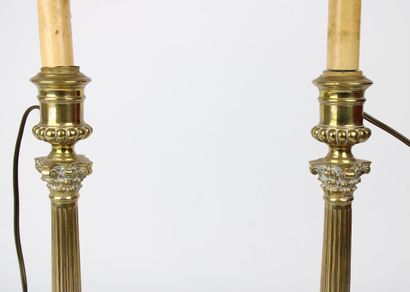 Pair of lamps in gilded brass, the shaft...