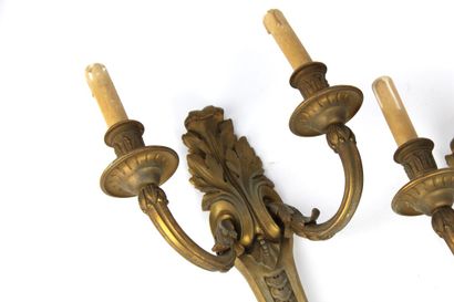 Pair of sconces in chased and gilded bronze...