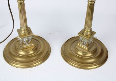 Pair of lamps in gilded brass, the shaft...