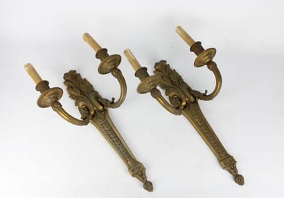 Pair of sconces in chased and gilded bronze...
