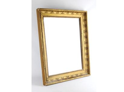 Miroir à décor de lyres, doré à la feuille....