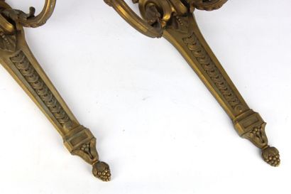 Pair of sconces in chased and gilded bronze...