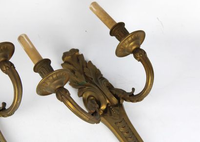 Pair of sconces in chased and gilded bronze...