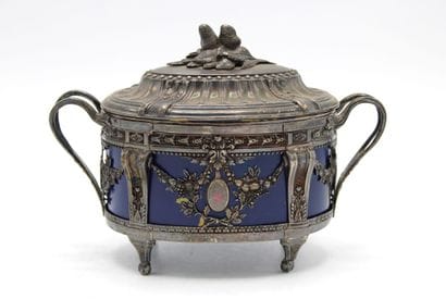 Covered sugar bowl of oval form, the silver...