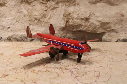 Plane in red lacquered sheet metal. Dimensions...