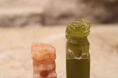 ASIA. Two jade stamps topped by a dragon....