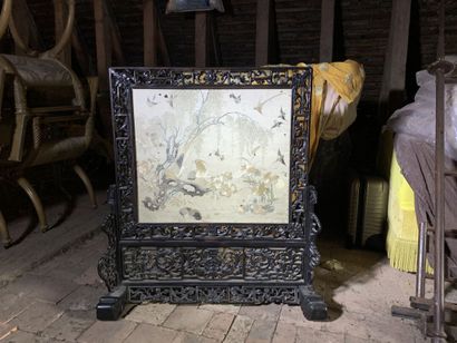 Black lacquered wood mantelpiece with an...