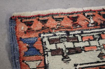 Knotted wool carpet with red border. 
Dimensions...