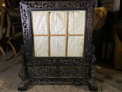 Black lacquered wood mantelpiece with an...