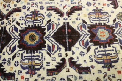 Knotted wool carpet with blue border. 
Dimensions...