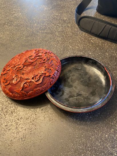 CHINA. Red lacquer box with dragons decoration....
