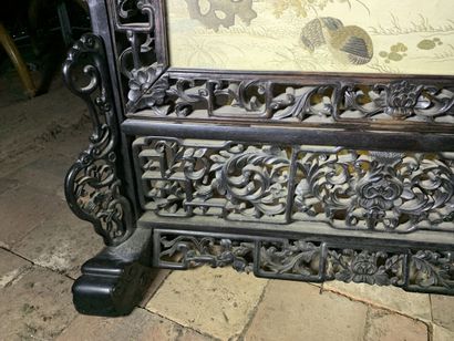 Black lacquered wood mantelpiece with an...