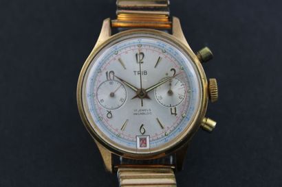 TRIB
Chronographe bracelet plaqué or. Boitier...