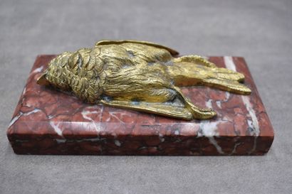Paperweight representing a dead bird, chased...