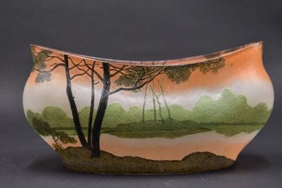 LEGRAS. Planter with oval body and curved...