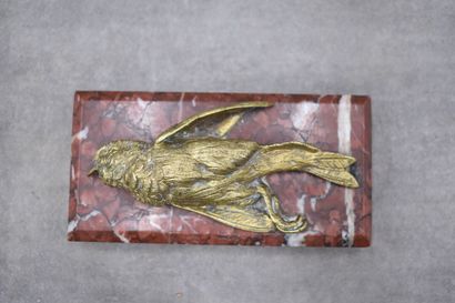 Paperweight representing a dead bird, chased...
